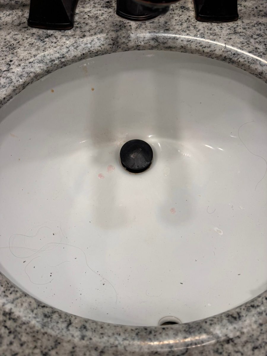 Bathroom sink before Tidy Sparkles cleaning