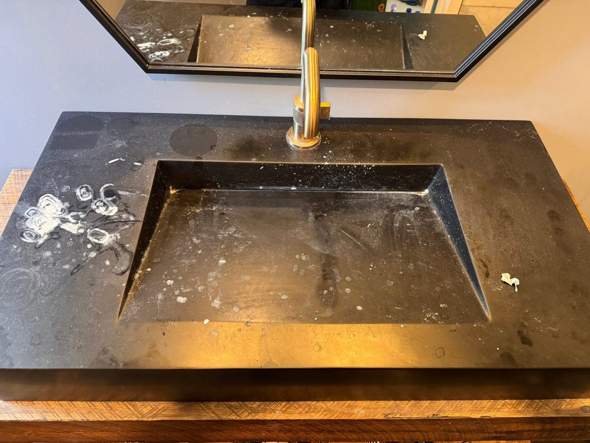 Black trough sink before Tidy Sparkles cleaning